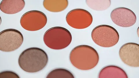 Selective focus of eyeshadow palette with various colors in pearly and matte Stock Photos