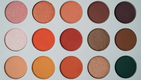 Selective focus of eyeshadow palette with various colors in pearly and matte Stock Photos