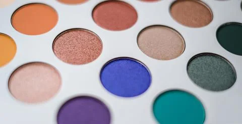 Selective focus of eyeshadow palette with various colors in pearly and matte Stock Photos