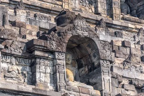 Selective focus on the face figure on the relief made of stone exposed to t.. Stock-Fotos