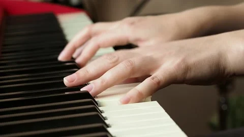 Selective focus of female hands playing the piano. Stock Footage 197091687
