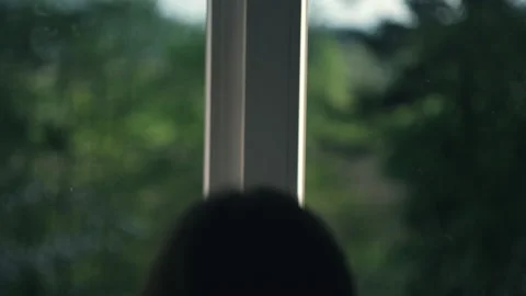 Selective focus of female hands pulling window curtain for warm morning light Stock Footage 243670853