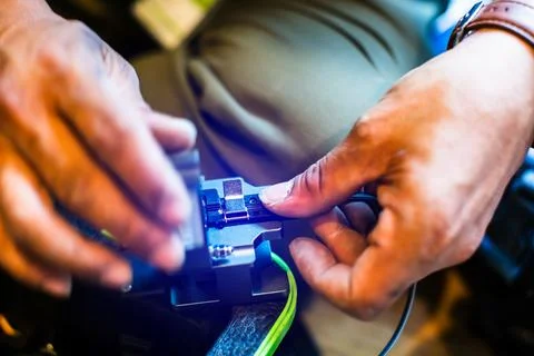 Selective focus to fiber optic splicing cable tools. Fixing Internet Cable... Stock Photos