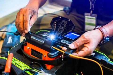 Selective focus to fiber optic splicing cable tools. Fixing Internet Cable... Stock Photos
