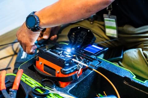 Selective focus to fiber optic splicing cable tools. Fixing Internet Cable... Stock Photos
