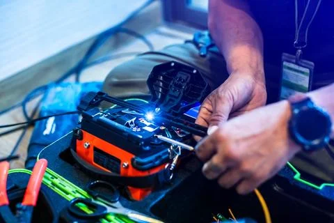 Selective focus to fiber optic splicing cable tools. Fixing Internet Cable... Stock Photos