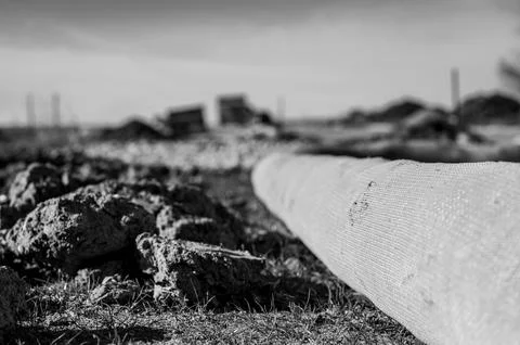 Selective focus on filter sock around exposed dirt at a construction site to Foto stock
