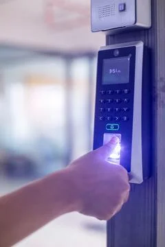 Selective focus to finger scan reader with finger is scaning on it. Electro.. Stockfoto's