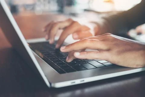 Selective focus finger typing on laptop computer Stock Photos