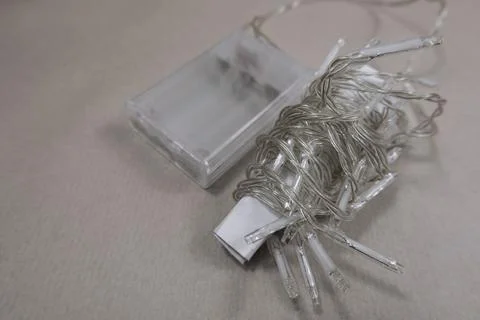 Selective focus flat lay string Christmas lights storage. Neatly wrapped up Stock Photos