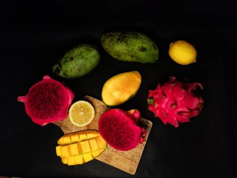 Selective focus of fresh fruit on black background Stock Photos