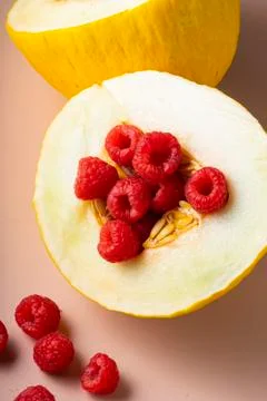 Selective focus. fresh ripe fruit, melon and raspberry Stock Photos