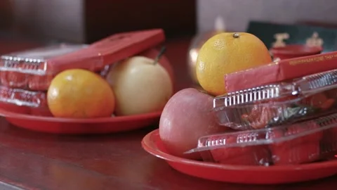 Selective focus of fruit and cake offering for god at chinese shrine. manda.. Stock Footage 326304445