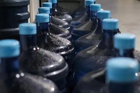 Selective Focus Gallons or plastic bottles of purified drinking water Stock Photos