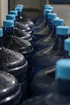 Selective Focus Gallons or plastic bottles of purified drinking water Stock Photos