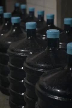 Selective Focus Gallons or plastic bottles of purified drinking water Stock Photos