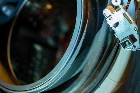 Selective Focus on the gasket mount of a front loading washing machine being Stock Photos