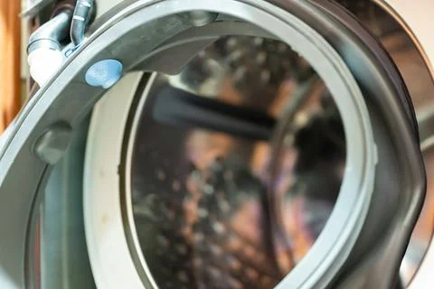Selective Focus on the gasket mount of a front loading washing machine being Stock Photos