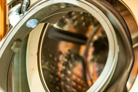 Selective Focus on the gasket mount of a front loading washing machine being Foto stock