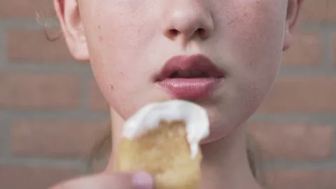 Selective focus. Girl eats chicken nuggets harmful and tasty fast food. 스톡 동영상 136964352