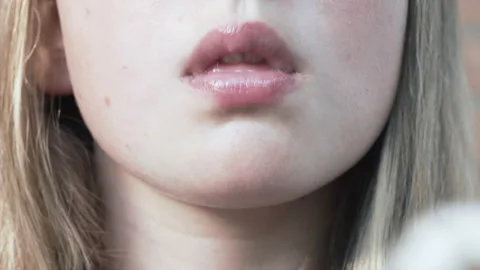 Selective focus. Girl eats chicken nuggets harmful and tasty fast food. 스톡 동영상 136978752