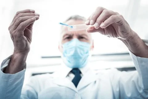 Selective focus of glass with a test sample on it Stock Photos