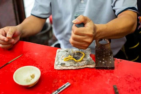 Selective focus to the goldsmith is using blowing rubber ball Stock Photos