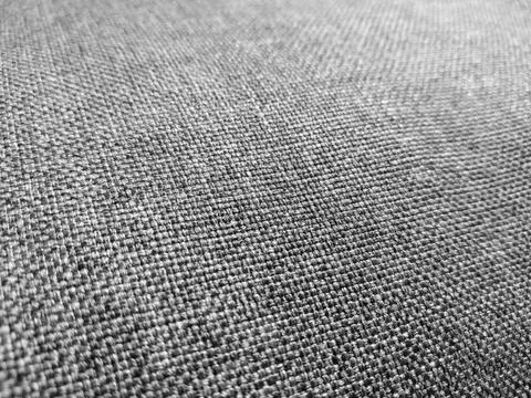 Selective focus of gray textured fabric. Closeup grey fabric texture. Foto stock