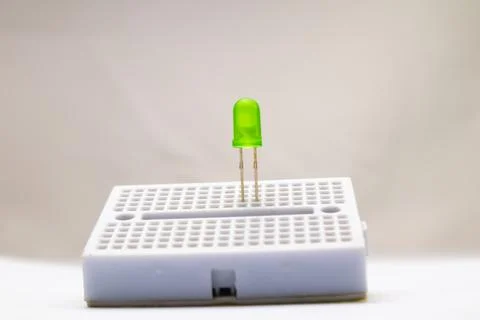 Selective focus from a green LED embedded in the project board. This part is  Stock Photos