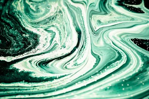 Selective focus. Green malachite creative abstract painted background, wallpa Stock Photos