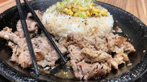 Selective focus grilled beef steak with korean sauce bulgogi on top of rice w Stock Photos