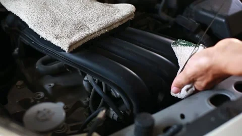 Selective focus to hand checking the oil level in car engine. Stock Footage 147562119
