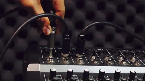 Selective focus hand someone connect USB connectors  on the sound music mixer. Video stock 80082830