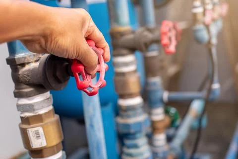 Selective focus to hand turning valve of water pipe before fixing. Plumbing.. Stock Photos