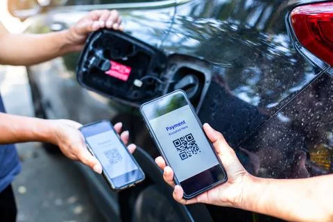 Selective focus to Hand using smart phone to scan QR code tag. Stock Photos