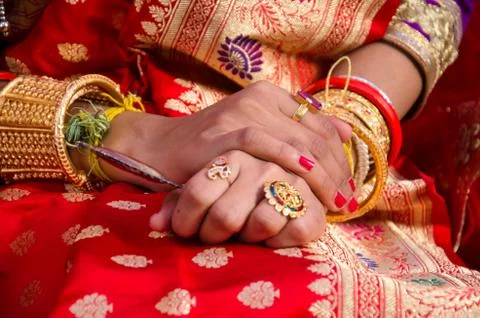 Selective focus on hands of a beautiful bride. Stock Photos