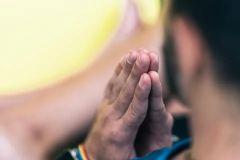 Selective focus on the hands of a man with a rainbow bracelet Stock Photos