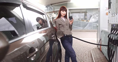 Selective focus of happy dreamy young stylish woman, looking away, standing near Stock Footage 152639897