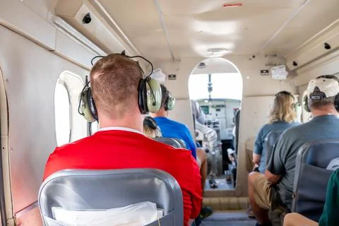 Selective focus headset on a passenger inside a small private tour plane. Foto stock