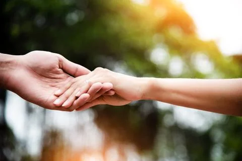 In selective focus of the human hands holding together,Love hand sign,for tru Stock Photos