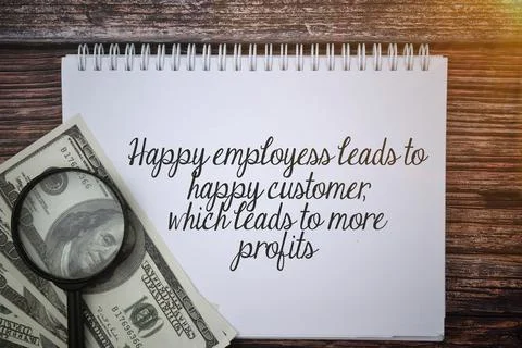 Selective focus image of bank note and magnifying glass with Happy employees  Stock Photos
