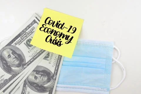 Selective focus image bank note and face mask with Covid-19 Economy Crysis wo Stock Photos