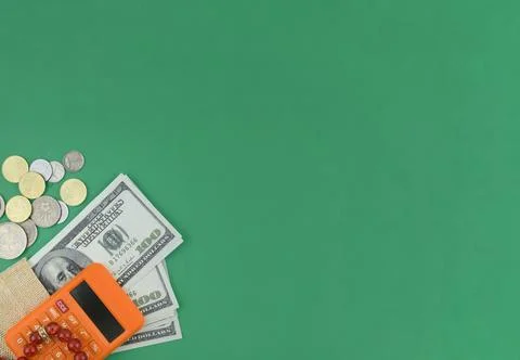 Selective focus image of bank note,coin and calculator with copy space on gre Stock Photos
