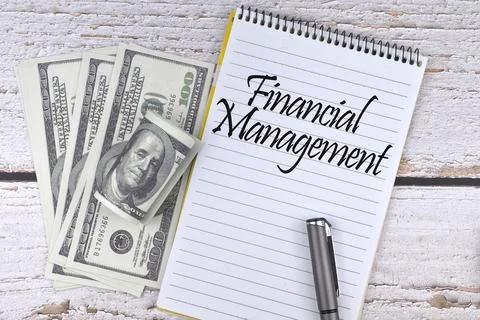 Selective focus image of banknote and pen with Financial Management wording o Stock Photos