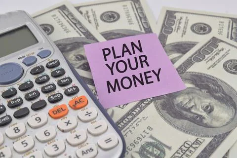 Selective focus image of calculator and usd bank note with plan your money wo Stock Photos