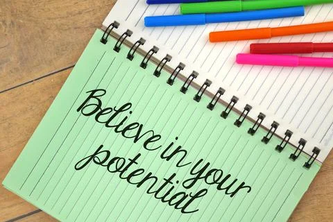 Selective focus image of colorful pen with book and Believe in your potential Stock Photos