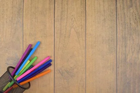 Selective focus image of colorful pen on a wooden background with copy space Stock Photos