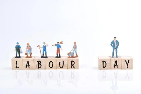 Selective focus image of group of miniature people and wooden block with Labo Stock Photos
