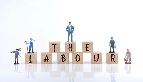 Selective focus image of group of miniature people and wooden block with Labo Stock Photos