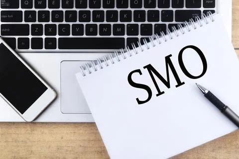 Selective focus image of laptop,phone and pen with SMO or Social Media Optimi Stock Photos